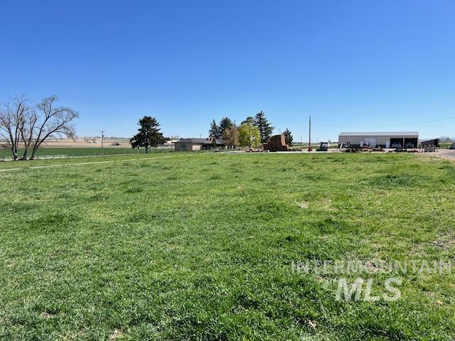 view of yard with a rural view
