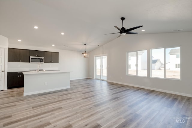 7308 E Marble Springs Dr, Nampa, ID 83687 - unfurnished living room with recessed lighting, a ceiling fan, a sink, and light wood-type flooring