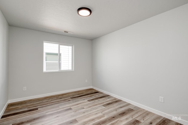7308 E Marble Springs Dr, Nampa, ID 83687 - empty room featuring visible vents, wood finished floors, and baseboards