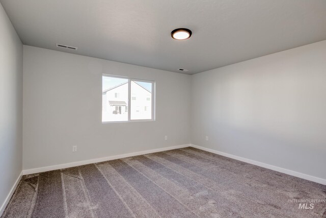 7308 E Marble Springs Dr, Nampa, ID 83687 - unfurnished room featuring baseboards, visible vents, and carpet floors