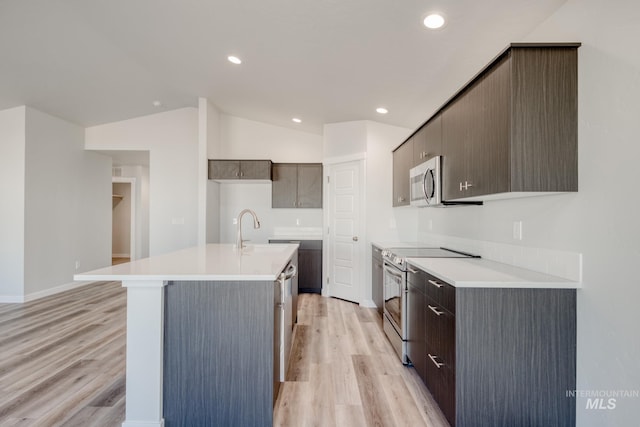7308 E Marble Springs Dr, Nampa, ID 83687 - kitchen featuring light countertops, a sink, appliances with stainless steel finishes, and light wood-type flooring