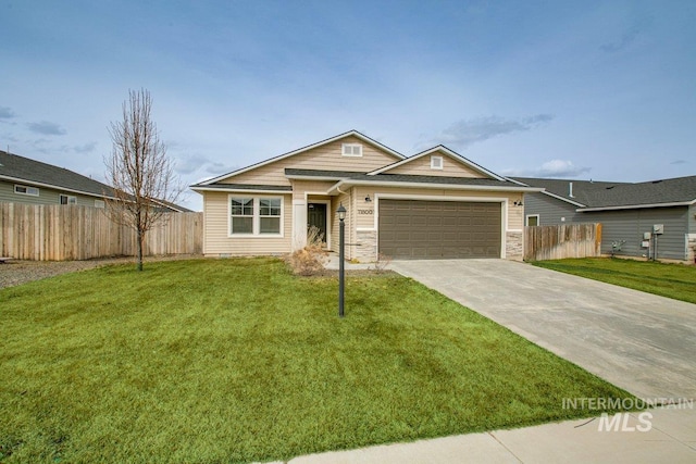 view of front of home with a garage, concrete driveway, a front lawn, and fence