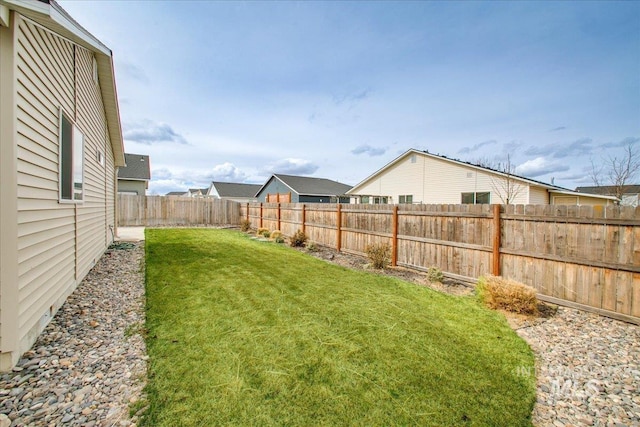 view of yard featuring a fenced backyard