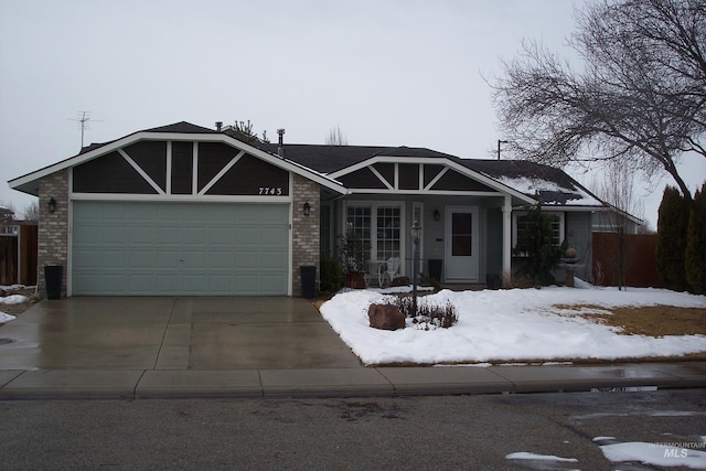 ranch-style house with brick siding, driveway, and an attached garage