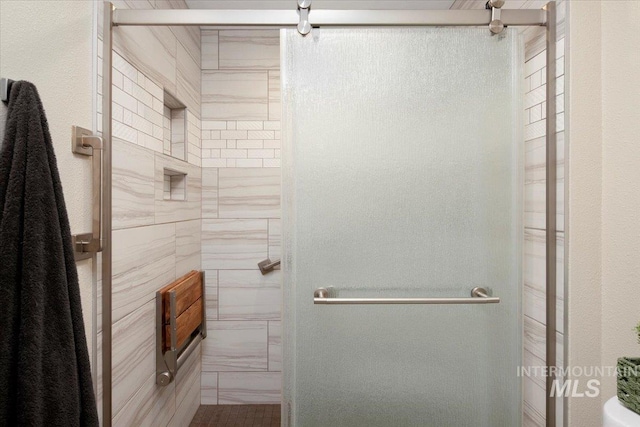 bathroom featuring a shower stall