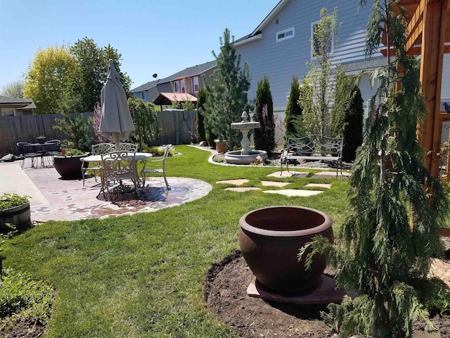 view of yard with a patio and fence