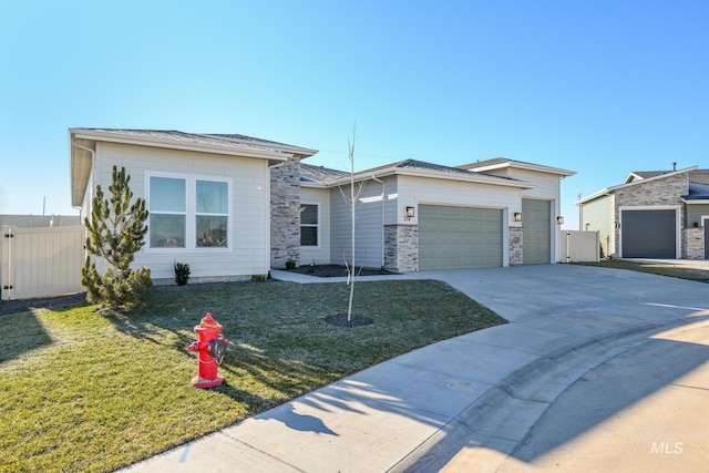 view of front of property with a garage and a front yard