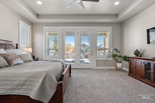 1102 N Longhorn Ave, Eagle, ID 83616 - bedroom with light carpet, a tray ceiling, baseboards, and access to exterior