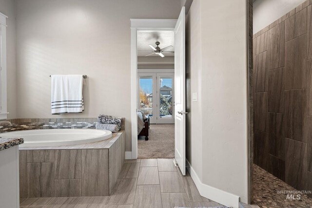 1102 N Longhorn Ave, Eagle, ID 83616 - bathroom with ceiling fan, a garden tub, connected bathroom, baseboards, and walk in shower