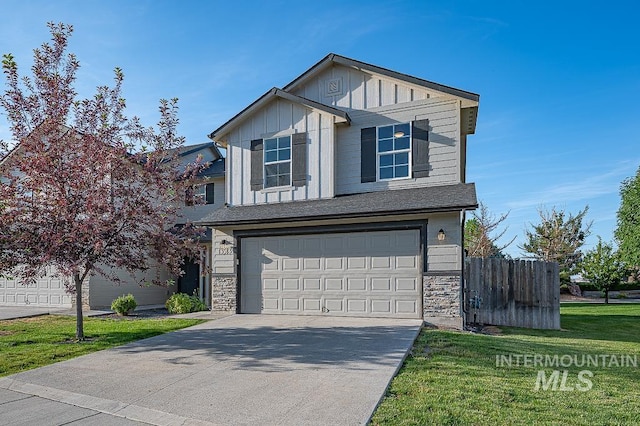 13513 Palm Bch, Caldwell, ID 83607 - view of front of home with board and batten siding, driveway, a garage, and stone siding