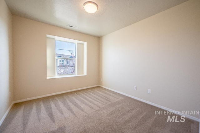 13513 Palm Bch, Caldwell, ID 83607 - empty room featuring carpet and baseboards