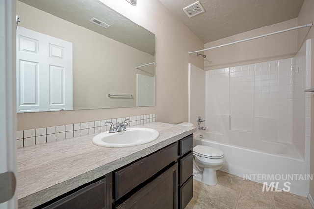 13513 Palm Bch, Caldwell, ID 83607 - bathroom with vanity, tub / shower combination, and decorative backsplash