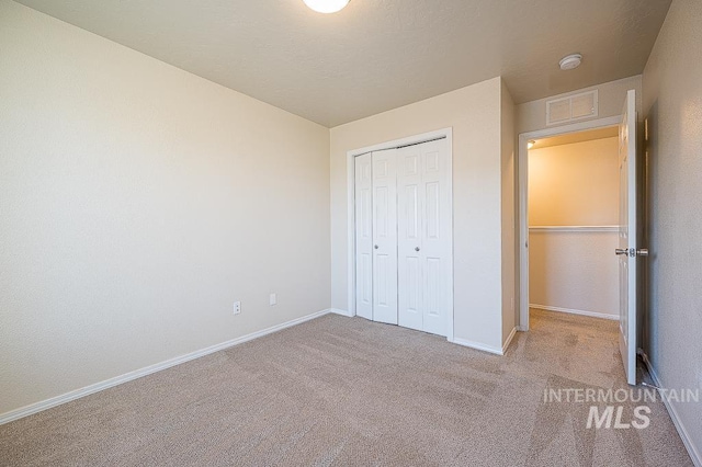 13513 Palm Bch, Caldwell, ID 83607 - unfurnished bedroom featuring carpet flooring and a closet