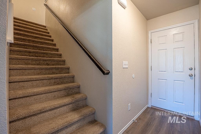 13513 Palm Bch, Caldwell, ID 83607 - staircase with wood finished floors and a textured wall