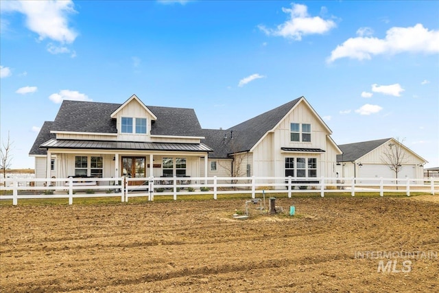 10935 Purple Sage Rd, Middleton, ID 83644 - view of front of property with a standing seam roof, fence, roof with shingles, board and batten siding, and metal roof