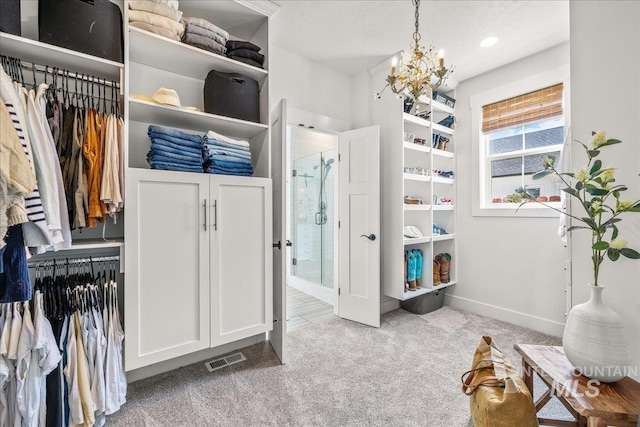 10935 Purple Sage Rd, Middleton, ID 83644 - walk in closet with a chandelier, visible vents, and carpet
