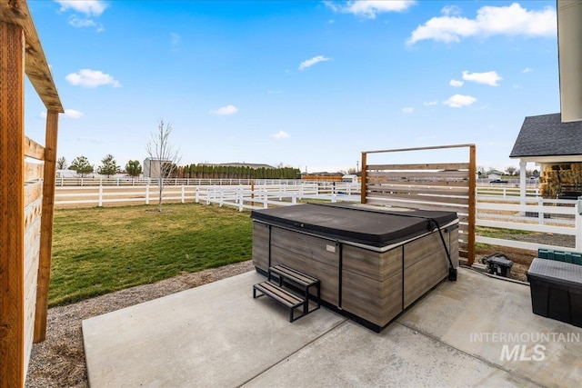 10935 Purple Sage Rd, Middleton, ID 83644 - view of patio featuring a rural view, a hot tub, and fence