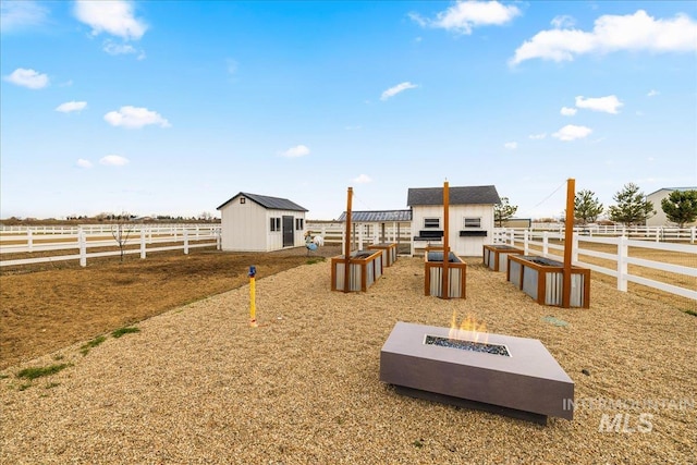 10935 Purple Sage Rd, Middleton, ID 83644 - view of yard featuring an outbuilding, a rural view, and fence