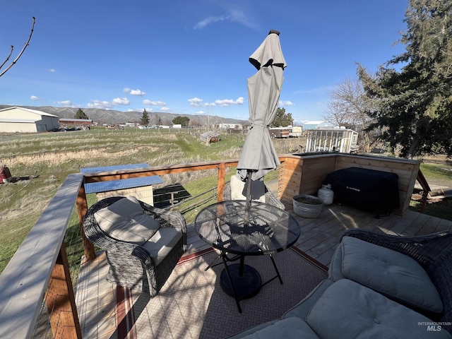 wooden deck with outdoor dining space