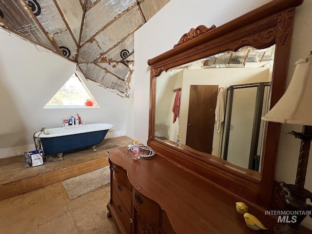 bathroom with a soaking tub and a stall shower