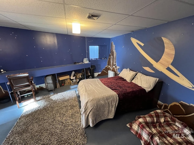 bedroom with visible vents and a paneled ceiling