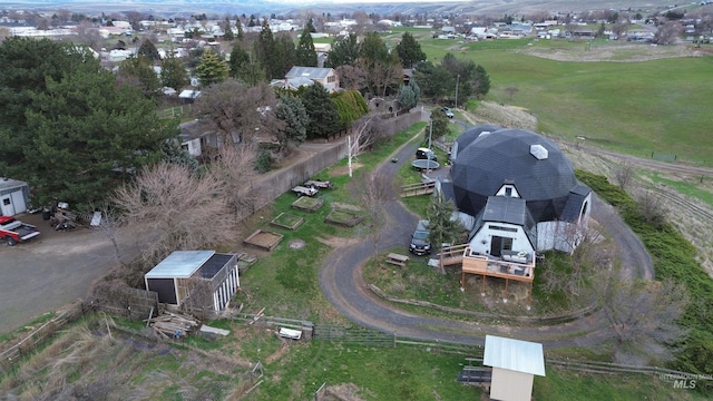 birds eye view of property with a rural view