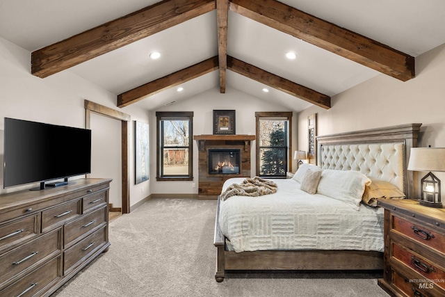 bedroom featuring light colored carpet, a tiled fireplace, and lofted ceiling with beams