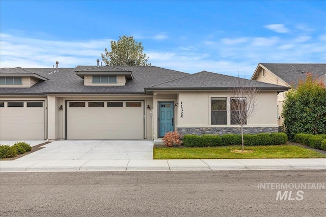 view of front of property with a garage