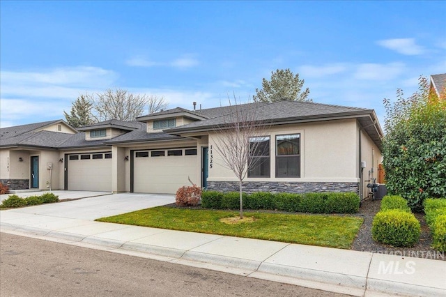 view of front of home with central air condition unit and a garage