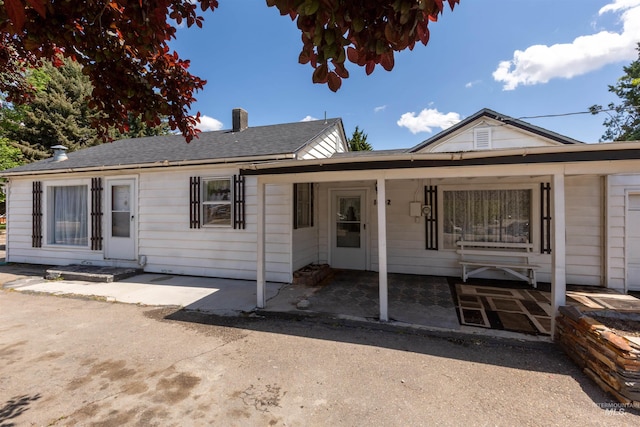 1402 Southside Blvd, Nampa, ID 83686 - view of front of house with a chimney