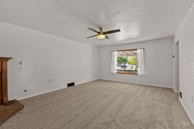 1402 Southside Blvd, Nampa, ID 83686 - unfurnished room featuring ceiling fan, light colored carpet, a textured ceiling, and baseboards