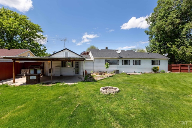 1402 Southside Blvd, Nampa, ID 83686 - back of house with a fire pit, a patio area, and central AC unit