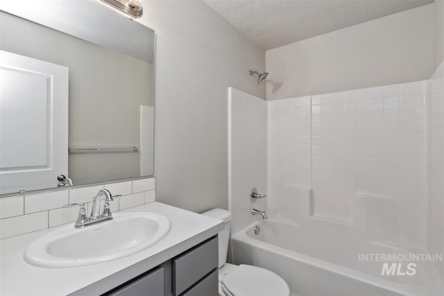 full bathroom featuring decorative backsplash, shower / bath combination, vanity, toilet, and a textured ceiling