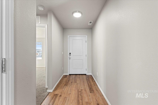 hallway featuring hardwood / wood-style flooring