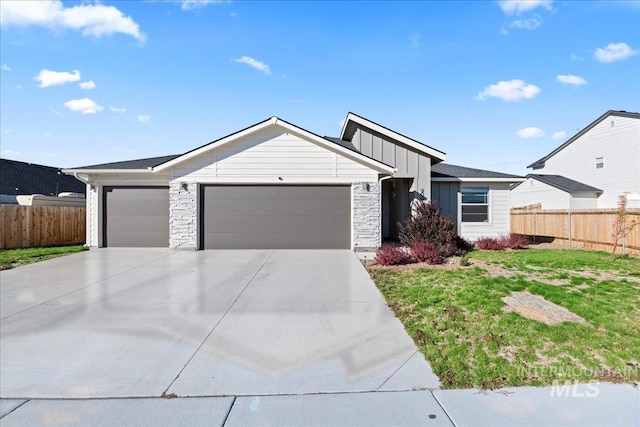 single story home featuring a garage and a front yard