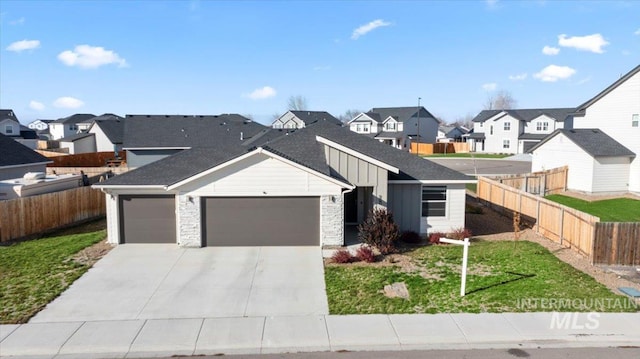 view of front facade with a garage and a front lawn