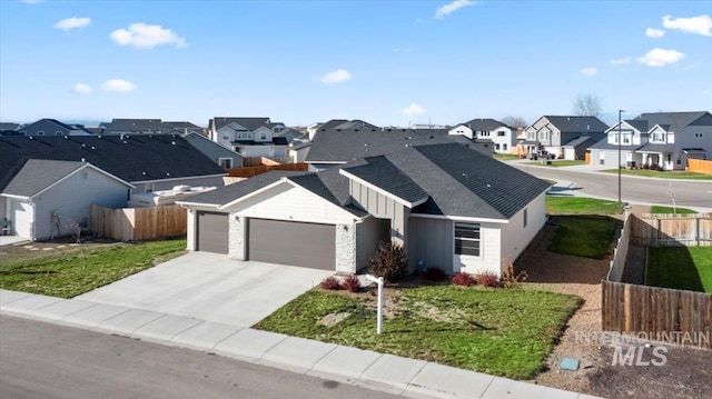 view of front facade with a garage and a front lawn