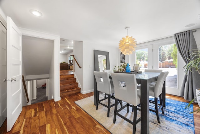 1309 S Pacific St, Boise, ID 83705 - dining room featuring a chandelier, stairs, and wood finished floors