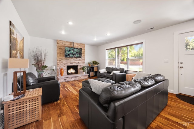 1309 S Pacific St, Boise, ID 83705 - living area featuring wood finished floors, healthy amount of natural light, a stone fireplace, and recessed lighting