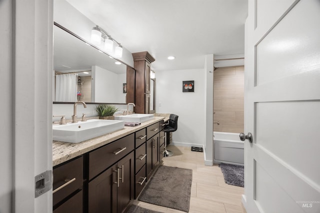 1309 S Pacific St, Boise, ID 83705 - full bath featuring double vanity, recessed lighting, and tile patterned flooring