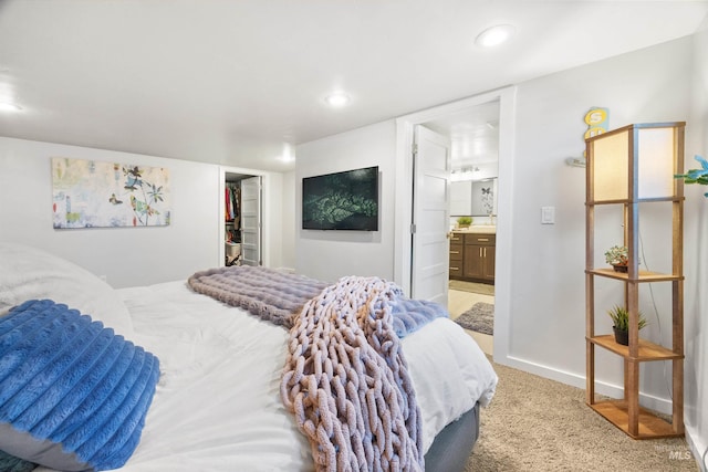 1309 S Pacific St, Boise, ID 83705 - bedroom featuring light carpet, a walk in closet, ensuite bath, recessed lighting, and a closet