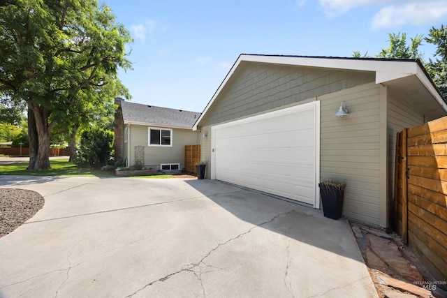 1309 S Pacific St, Boise, ID 83705 - view of side of property with a garage and driveway