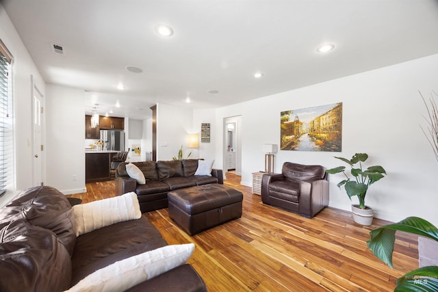 1309 S Pacific St, Boise, ID 83705 - living room featuring light wood finished floors and recessed lighting