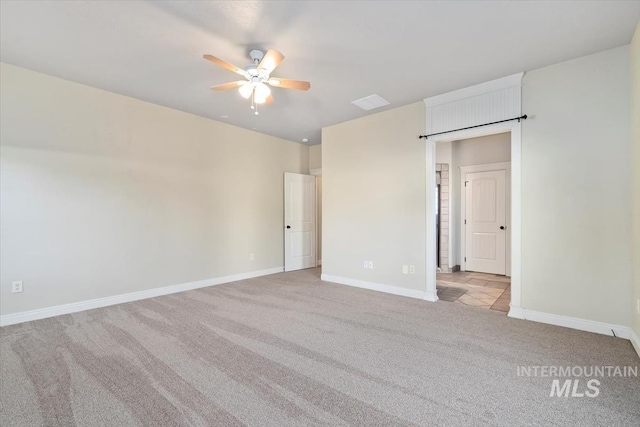 unfurnished bedroom with carpet floors, baseboards, and ceiling fan
