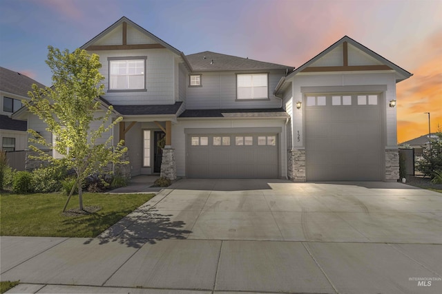 125 S Eagles Roost Way, Eagle, ID 83616 - view of front of house featuring concrete driveway, a shingled roof, stone siding, a front lawn, and an attached garage