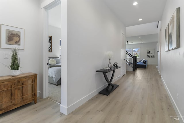 125 S Eagles Roost Way, Eagle, ID 83616 - corridor featuring light wood-type flooring, stairway, and recessed lighting
