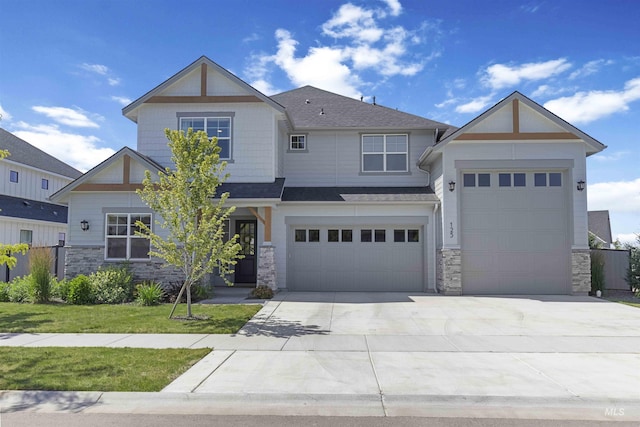 125 S Eagles Roost Way, Eagle, ID 83616 - craftsman house with stone siding, concrete driveway, roof with shingles, and a front lawn
