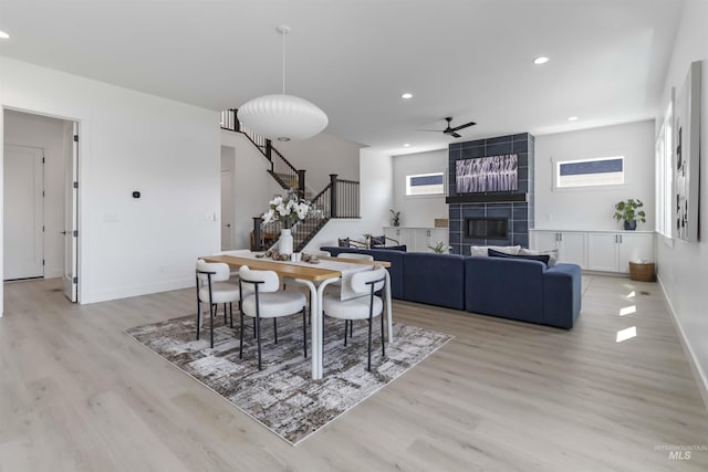 125 S Eagles Roost Way, Eagle, ID 83616 - dining area featuring stairs, plenty of natural light, light wood-style flooring, and recessed lighting