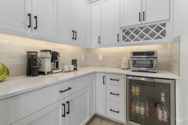 125 S Eagles Roost Way, Eagle, ID 83616 - bar area featuring wine cooler and decorative backsplash
