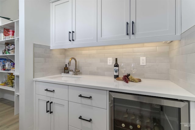 125 S Eagles Roost Way, Eagle, ID 83616 - indoor bar with wine cooler and tasteful backsplash
